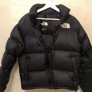 Black north face coat in woman’s size Medium